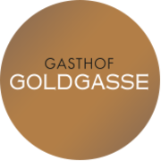 Rundes Logo des Gasthof Goldgasse mit goldenem Hintergrund 